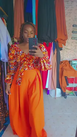 orange pants and tops available in all colors and sizes.  #wideleggedpants #wraptopstyles #fashiondesigner #fashionistalizzie #pallazoplussize #model #botiqcollection #creatorsearchinsights 