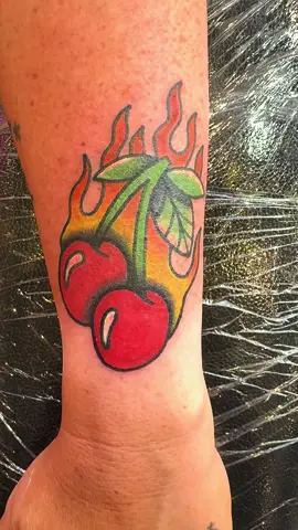 My first full colour tattoo 🍒🔥 #tattooapprenticeuk #apprenticelife #tattooartist #apprenticetattoo #forearmtattoo #traditional #boldwillhold #colourtattoo #cherrytattoos #flamestattoo 