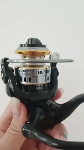 fishing reel  HE500 mesin warna hitam emas 
