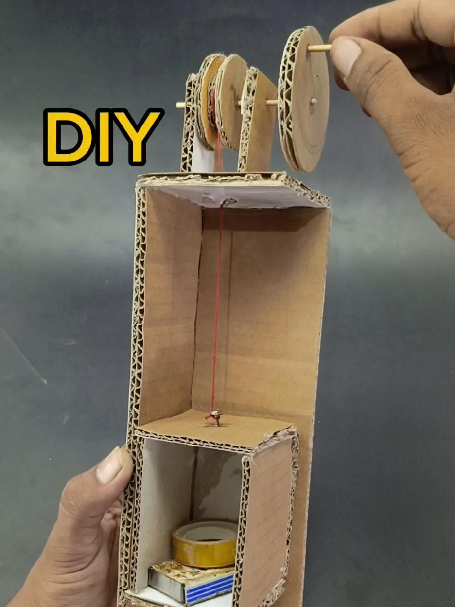 Mini Elevator Made with Cardboard! Simple cardboard elevator using pulley system 🚀 #diyproject #cardboardcraft #elevator #pulleyproject #engineeringforkids #minilift #fyp 