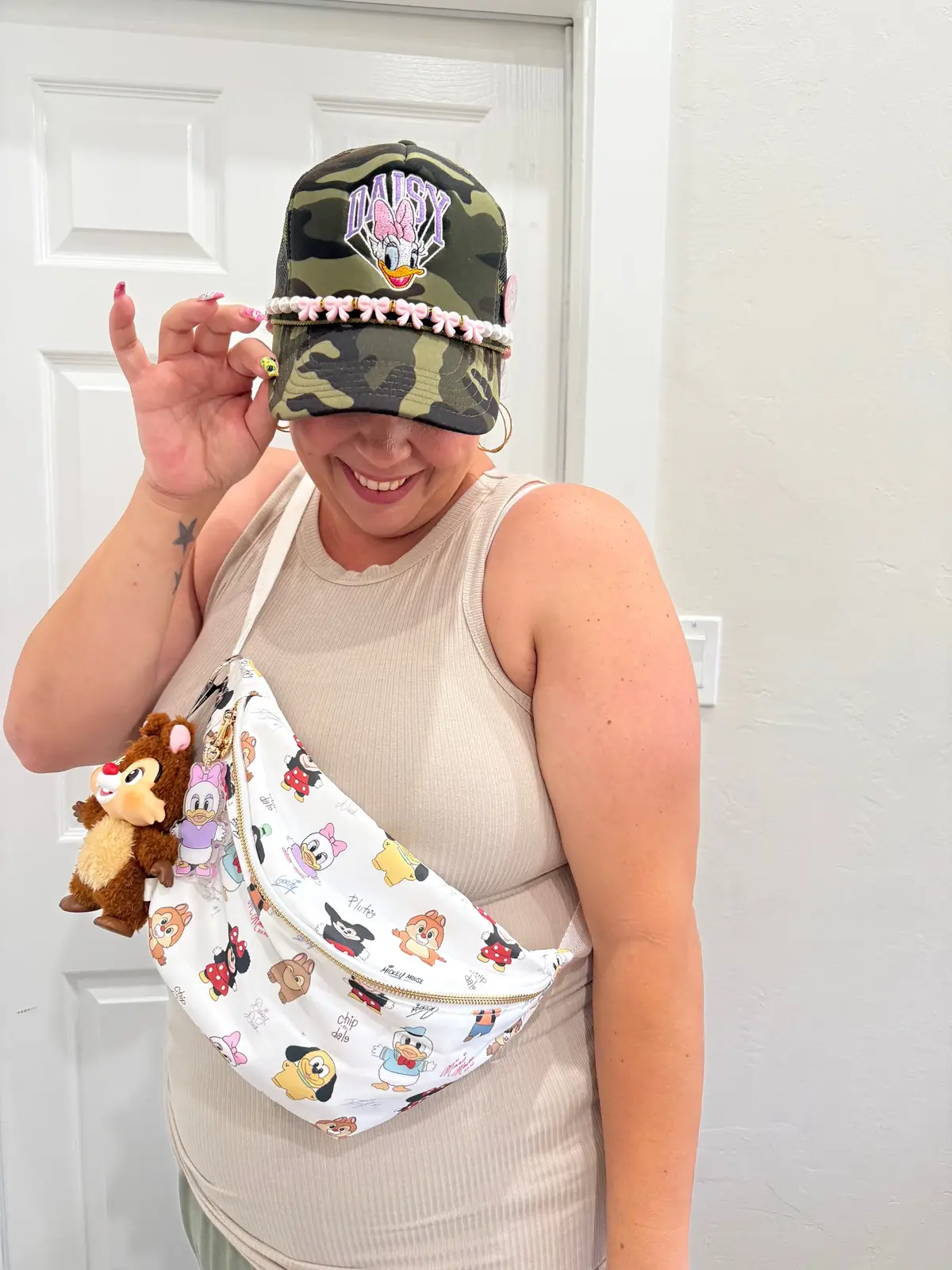 Just over here mixing camo with cuteness and calling it park chic 😎✨ Hat: @Magic Tees  Bag and charm: @Sew Magic Co. (code: SHAY for discount) Chip: @POP MART US  If you could carry around one Disney character as your sidekick for the day… who are you choosing? 👀👇 #disneyootd #disneyadult #disneymom #disney #chipanddale #mickeycutetogether #mickeylabubu #labubu 