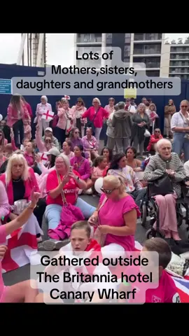 Lots of proud women gathered outside the Britannia hotel Canary wharf ##viral##uk##fyp##unitedkingdom##british##britain##england##flag##proud##reform##unite##hotelroom##cross##pink##women##lady