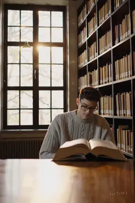 Guy reading a book in the library. #sorachatgpt 