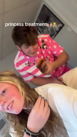 blow drying my hair while wears a shirt woth me and my dogs face on it 