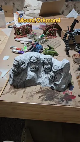 Painting terrain fit for a WAAAGH! Turning Mount Rushmore into MOUNT ORKMORE 💚💣 Nothing says battlefield dominance like some proper grimdark patriotism.  #MountOrkmore #Warhammer40K #TerrainPainting #MiniaturePainting #WargamingCommunity #TabletopWargaming #Orks40K #OrkTerrain #GrimdarkFuture #WAAAGH #TikTokMiniatures #PaintingMiniatures #WarGamingTikTok #CraftTok #TTRPGTerrain #GamesWorkshop #CreativeTerrain #DioramaArt #AtomicBulldogCrafts