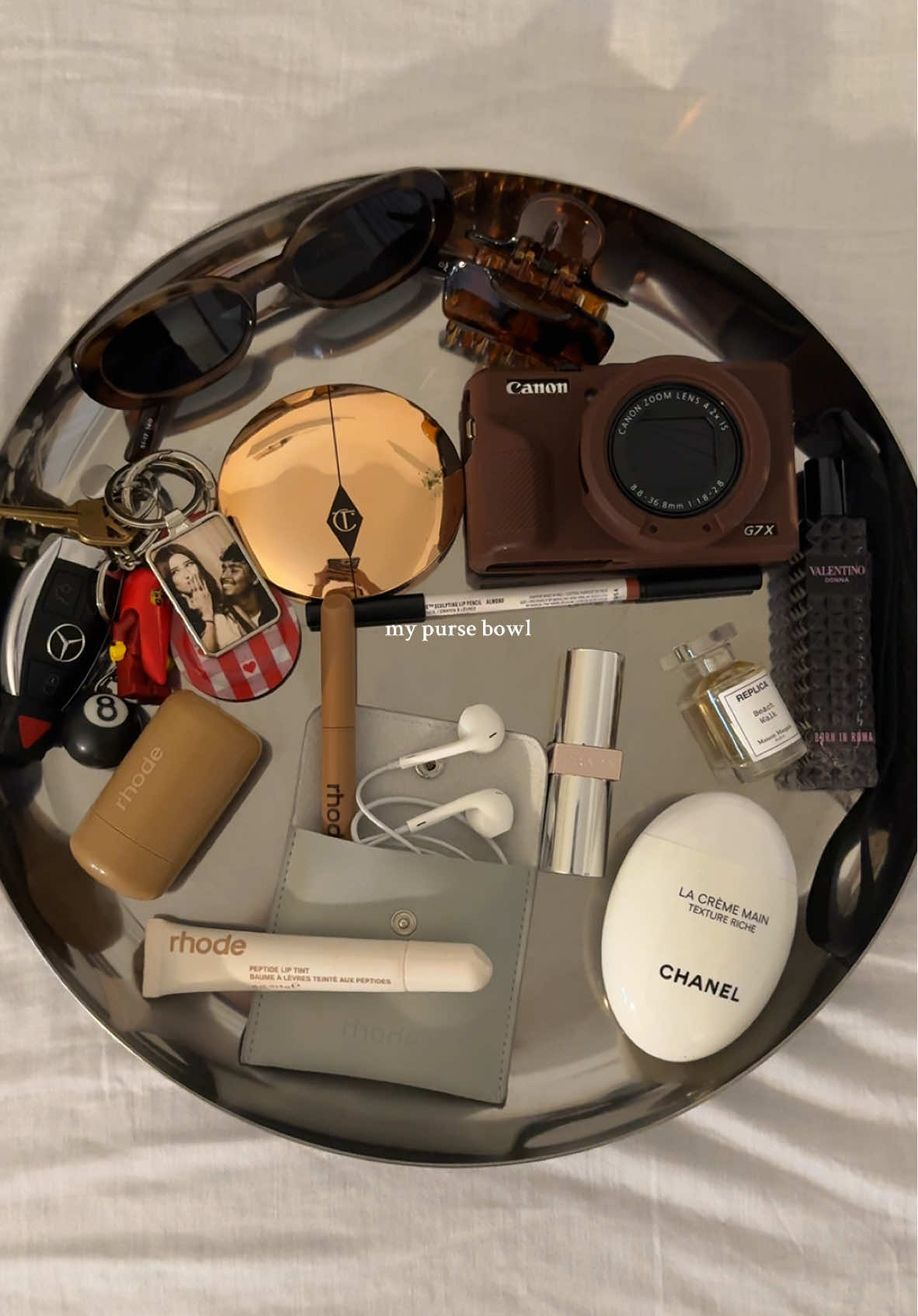guaranteed to always have this in my bag + a 35 stick gum pack 🙂‍↕️ #pursebowl #purseessentials #whatsinmybag @rhode skin @Charlotte Tilbury @pradabeauty @Valentino.Beauty @Chanel @Le Specs 