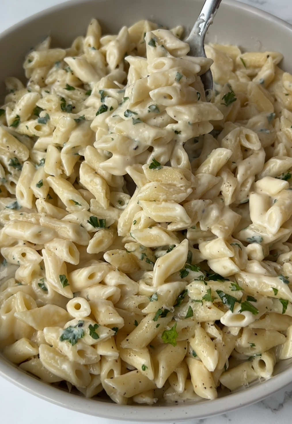 roasted garlic & brown butter alfredo pasta 😍🍝🧄🧀 Recipe ⬇️ Ingredients: 8 oz pasta 3/4 cup heavy cream 1 cup grated parmesan cheese 4 tbsp butter 1 head of garlic Salt & pepper, to taste Fresh parsley, for garnish Instructions: - Preheat oven to 400°F. - Cut the top off a garlic head to expose the cloves. Drizzle with olive oil and sprinkle with salt. - Wrap in foil and bake for 30–60 min, until soft and golden. Let it cool, then squeeze out and mash the cloves into a paste. - Cook pasta according to package instructions. - In a pan, melt butter over medium heat until golden brown and nutty smelling. Stir often to prevent burning. - Add the roasted garlic paste anyone mix well. - Stir in heavy cream. Lower heat and slowly add parmesan, stirring until smooth. - Season with salt and pepper. - Add pasta to the sauce and toss until creamy. - Serve topped with parsley and extra cheese. #pasta #fyp #alfredopasta #EasyRecipe #pastatiktok #creatorsearchinsights #recipeideas 