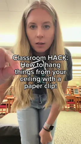 Classroom HACK: how to hang things from your ceiling with a paper clip! #librariansoftiktok #librarytiktok #librarian #classroomhack #hack #classroom #teacher #teachersoftiktok #fyp 
