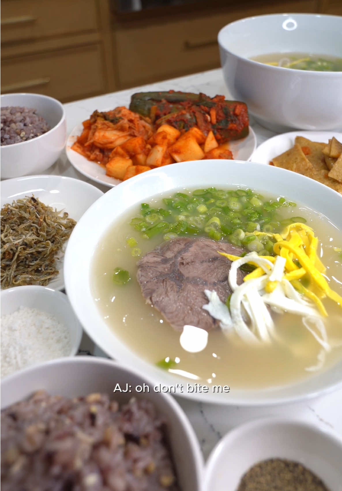 SULLUNGTANG   BROTH 5 lbs beef bones* 2 lb beef shank or beef brisket 10 quarts water *you can use neck bones, beef marrow bones, beef knuckle or any variation     FOR SERVING: Noodles* Chopped scallion Salt Black pepper MSG Egg yolk strips Egg whites strips     INSTRUCTIONS: 1.        Soak beef bones in water for at least 1 hour. Then rinse, drain and wash bones under cold water. 2.        Next, we have to par boil the bones. To par boil, fill a pot up with the bones and water. Bring this to a boil and leave to boil for 5 minutes. Then rinse and drain bones under cold water. 3.        To make the broth, fill a stock pot (or a pot large enough) with the par boiled bones and 8 quarts water. Bring this to a boil and then reduce heat and simmer for at least 6 hours. 4.        During the remain 2-3 hours of simmering, you are going to add your beef shank or beef brisket. 5.        Cook your beef shank through and then remove from heat and allow to completely cool before thinly slicing. Your broth is not done. 6.        With the remainder of your broth, scoop out any large bones and discard. Then pour the rest of your broth through a fine strainer. Now your broth is done. 7.        Assemble a bowl of sullungtang with noodles, thinly sliced beef/ brisket, scallion, egg yolk/ white strips. Season personal bowl with salt, pepper and/or MSG. 8.        I served this with galbi, rice, kimchi and a few other banchans.   NOTES: - Beef shank needs to be sitting in water for at least 1 hour before cooking. - While your broth is simmering, you need to scoop out any impurities that float to the top. The impurities are often brown, black, grey - Please add water as you are simmering because some of your broth will evaporate. - This dish should be served scorching hot/ boiling hot