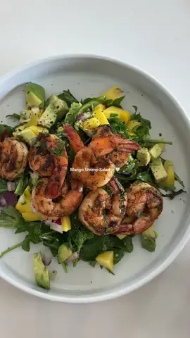 Shrimp Mango Salad Recipe (aka the BEST you’ll ever have) 🥭🦐✨ This recipe was enough for two! Ingredients: 	•	1 ripe mango 	•	1/4 red onion (thinly sliced) 	•	1 green onion (I almost used one stick) 	•	A handful of arugula (enough for two people) 	•	1 large avocado 	•	1 small lime (zest + juice) 	•	Olive oil 	•	Salt 	•	Cooked shrimp or salmon (I meal-prepped mine!) Instructions: 	1.	Dice the mango into small cubes and toss it into a bowl. 	2.	Thinly slice the red onion and green onion, and add those in too. 	3.	Cut your avocado and add half to the bowl and save the other half for garnish. 	4.	Add in a good handful of arugula (adjust to your liking). 	5.	Season with a pinch of salt, a drizzle of olive oil, lime zest, and a squeeze of lime juice. 	6.	Top with shrimp or salmon (best to meal prep these) 	7.	Garnish with the rest of the avocado + a sprinkle of everything bagel seasoning. #saladrecipe #saladsoftiktok #shrimp #healthyliving #foodtiktok 