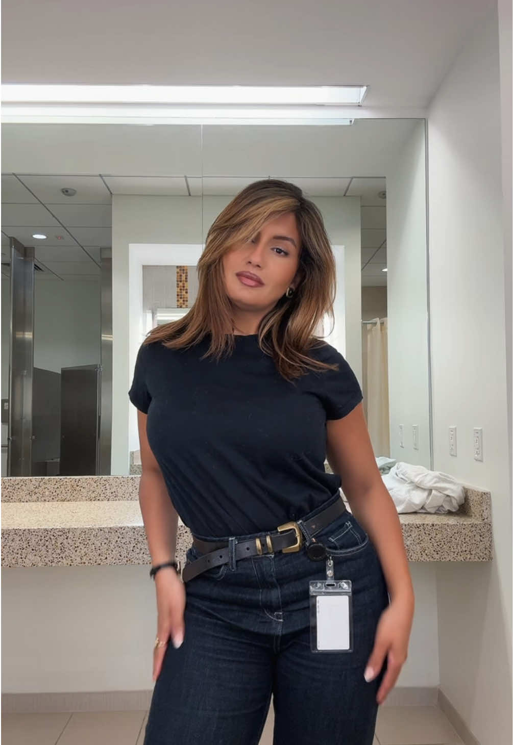 Corporate baddie OOTD   Casual formal outfit inspo  Dark jeans always elevate the look when it comes to wearing denim in an office setting. Black T that is not too oversize you can’t go wrong with that. Nice accessories like a good quality leather belt. Hair always done and brushed makes you look more put together. Kitty heels to soften up the jean look.  #OOTD #ootdinspo #corporatelife #workoutfitideas 