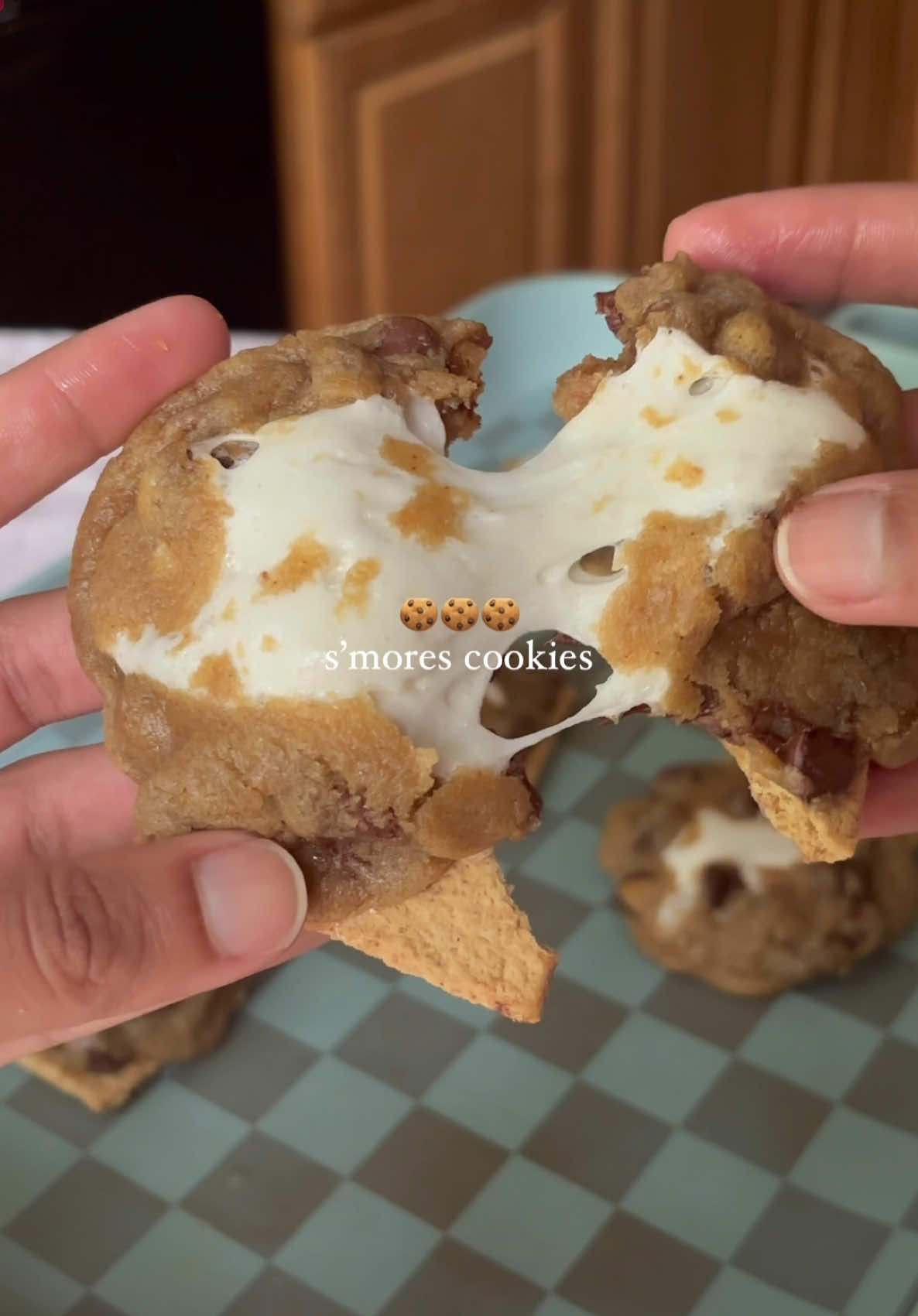 S’mores cookies🍪 Ingredients: - chocolate chip cookie dough (I used my brown butter CC cookie dough recipe from my ebook linked in my bio) - marshmallows (you can half them for less of a mess) - graham crackers Directions - Preheat oven to 350 F (or whatever temp your dough recipe says) - place 6 graham cracker squares on your baking tray, leaving a few inches between each piece. - using a cookie scoop, scoop some cookie dough then slightly flatten it out. Place a marshmallow (or half of one) in the middle then fold the outer edges inward so it’s covering the marshmallow. Roll it into a ball then place in on a graham cracker squares. Repeat with the rest of the dough. - Bake according to your cookie dough instructions then enjoy! #smorescookies #smores #cookiesoftiktok #bakingrecipe 