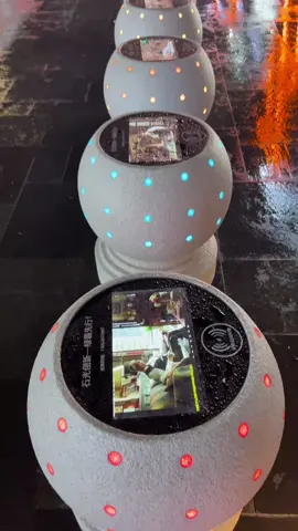 Shenzhen's cutting-edge technology: a smart stone pier that can be wirelessly charged and even used for TV viewing. It works even on rainy days – a truly high-tech experience! #WirelessCharging #StonePier #shenzhen 