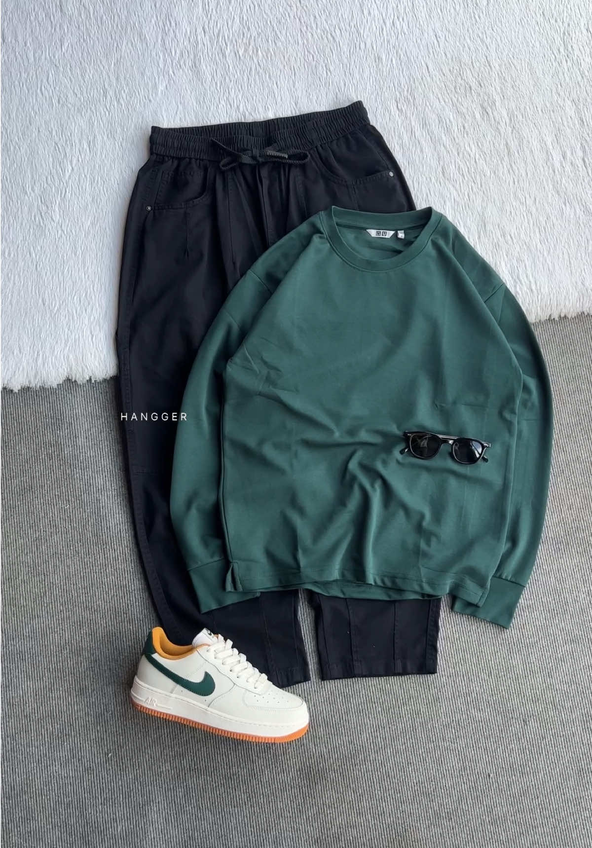 “Streetwear done right — clean, comfy, and a little bit classy. 🖤💚 #HanggerStyle #OOTD”