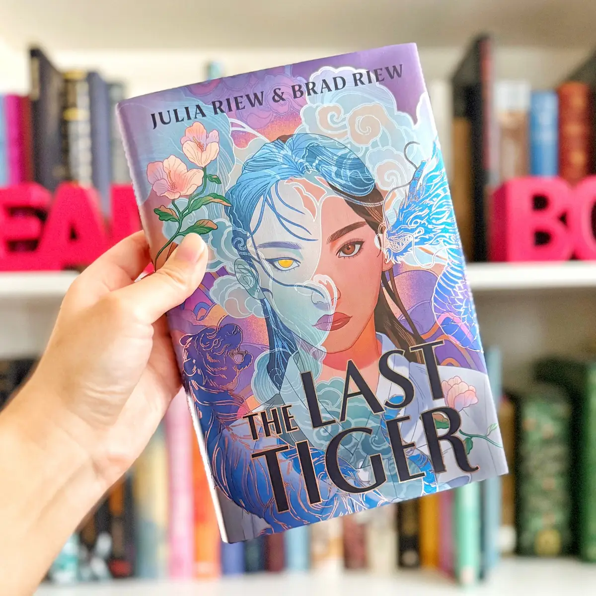Hi beauties! Today I have a review for YA fantasy, The Last Tiger by @Julia Riew and @Brad Riew (Thank you @Penguin Teen for the copy of the book). I gave this gorgeous book (just check out those edges 😍) 4 (⭐️⭐️⭐️⭐️) stars!  - - - REVIEW This was a powerful YA fantasy!  First off, I loved that the story was inspired by the authors’ grandparents and their romance during the Japanese occupation of Korea. Drawing on real life experiences gave the story a ton of emotional depth. I also enjoyed the dual POVs. The story is told in alternating points of view of the two leads, Seung and Eunji. Seung is poor while Eunji comes from a wealthy family, so you got to see two very different experiences. The supporting characters of Jin and Kenzo were also noteworthy. They were both very complex characters.  The world building was well done. Since this book is inspired by real events, the politics behind the world is relatively easy to understand. The magical aspect of Ki was also explained well. All in all, it was an easy to follow fantasy world.  In terms of romance, the story falls a little flat on that aspect. The romance was building well in the first third, but then lost its momentum. This book is more of a cultural fantasy than a romantasy.  The end of the book does subtly set up potential sequel ideas and I really hope there is one. There’s still a lot to explore in this world!  Overall, if you love Asian inspired fantasy, definitely check this one out!  - - - QOTD: Fantasy is such a broad genre. How do you like your fantasy (ex. Lots of romance, complex world building, fae inspired, etc.)? If you don’t read fantasy, what’s your favorite genre?  - - - #PenguinTeenPartner #TheLastTiger #YAFantasy #youngadult #asianfantasy #asianinspiredfantasy #bookreview #BookTok 