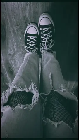 Ripped jeans and my favorite kicks. 🤘 Sometimes, the best outfits are the simple ones with a little attitude. What's your go-to look for a casual day?  #OOTD #StreetStyle #CasualOutfit #DenimStyle #Converse #ChuckTaylor #FishnetStockings #EdgyLook #FashionInspo #GrungeStyle
