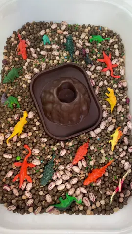 🦕🌋 Dino Volcano Sensory Tub 🌋🦕 Get ready for a ROARING adventure with our Dino Volcano Sensory Tub – where prehistoric play meets explosive science! 🧪 This hands-on sensory experience is packed with textured fillers like beans and pellets, scattered with colourful dinosaurs to spark imaginative small-world play. At the heart of the tub sits a mighty volcano, waiting to erupt! ✨ Let the eruption begin! ✨ Simply add bicarb soda, a splash of red food colouring, and a generous pour of vinegar into the volcano and watch as bubbly “lava” flows down, thrilling curious minds and engaging all the senses! 🎓 Benefits of this tub include:  • Encouraging STEM learning through cause and effect experiments  • Supporting fine motor skills through scooping, pouring, and manipulating materials  • Sparking imaginative play and language development  • Providing a multi-sensory experience for tactile exploration and visual stimulation Perfect for dino-lovers, budding scientists, and messy play enthusiasts! 🧡 🦖 Let the Jurassic fun erupt! 🌋 #DinoSensoryPlay #VolcanoEruption #CharlieAndMeSensory #MessyPlayFun #STEMforkids #SensoryPlayIdeas #ImaginativePlay #SmallWorldAdventures #VolcanoExperiment #EducationalPlay