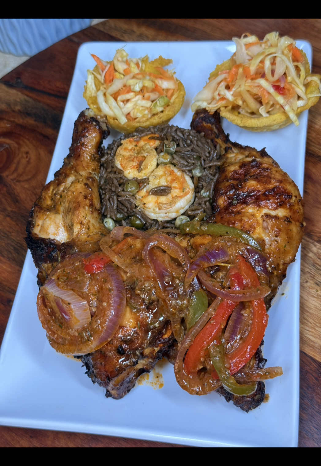 Saturday dinner at a Haitian household 🇭🇹😋 Haitian Black Mushroom Rice with Shrimp (Diri Djon Djon ak Kribich) Ingredients 	•	2 cups long-grain rice (jasmine or basmati) 	•	2 oz dried djon djon mushrooms 	•	3½ cups water (for fluffier rice) 	•	1 lb large shrimp, peeled & deveined 	•	1 tbsp lemon or sour orange juice (for cleaning shrimp) 	•	2 tbsp oil or butter (divided) 	•	2 cloves garlic, minced 	•	½ cup shallots , finely chopped 	•	1-2 cup mushrooms  	•	1–2 sprigs thyme and parsley  	•	2 tsp salt (adjust to taste) 	•	1 tsp black pepper 	•	1 Maggi cube (optional but authentic) 	•	1–2 Scotch bonnet poked with cloves 	•	1 tbsp epis (Haitian seasoning ) Instructions 	1.	Clean the Shrimp 	•	Rinse shrimp in water with lemon or sour orange juice. Drain and pat dry. 	•	Season lightly with salt, pepper, and 1 tsp epis. Set aside. 	2.	Make the Djon Djon Stock 	•	Rinse mushrooms briefly. 	•	Add mushrooms and 3½ cups water to a medium pot. 	•	Boil for 10–15 minutes until water turns black. 	•	Strain and reserve liquid. Discard mushrooms. 	3.	Cook the Shrimp 	•	Heat 1 tbsp oil/butter in a large pot over medium heat. 	•	Sauté shrimp for 1–2 minutes per side until just pink. 	•	Remove shrimp from pot and set aside (they’ll finish cooking in the rice). 	4.	Build the Rice Base 	•	In the same pot, add  oil 	•	Sauté epis onions and garlic until fragrant. 	•	Stir in green peas cook 2-4 minute. 	5.	Cook the Rice 	•	Add rice and stir to coat in aromatics. 	•	Pour in the djon djon stock, salt, pepper, Maggi, Scotch bonnet, thyme & parsley  	•	Bring to a boil, stir once, reduce heat to low, cover, and cook for 15 minutes. 	6.	Add the Shrimp Back 	•	After 15 minutes, place shrimp gently on top of the rice. 	•	Cover and cook for 3–5 more minutes until rice is done and shrimp are cooked through. 	7.	Serve 	•	Remove thyme and Scotch bonnet. 	•	Fluff gently with a fork, making sure shrimp are mixed evenly. Haitian Air-Fried Grilled Chicken (Poul Grillé nan Air Fryer) Ingredients 	•	3–4 lbs chicken pieces leg quarters  	•	¼ cup Haitian epis  	•	1 tbsp sour orange juice (or mix 2 parts orange juice + 1 part lime juice) 	•	1 tsp salt (adjust to taste) 	•	1 tsp black pepper 	•	1 tsp paprika (optional, for color) 	•	1 tsp garlic powder (optional, to boost flavor) 	•	1–2 sprigs fresh thyme or 1 tsp dried thyme 	•	1 tbsp Badia complete seasonings  	•	1 tbsp oil (helps with crisping in the air fryer) Instructions: 	1.	Prep the Chicken 	•	Wash chicken with water and a  lime or sour orange juice and vinegar. Make 2 slits to allow seasons to get through  chicken  	•	Pat dry with paper towels. 	2.	Season the Chicken 	•	In a large bowl, mix epis, lime juice, salt, pepper, paprika, garlic powder, thyme, Badia seasoning and oil. 	•	Rub seasoning all over the chicken, making sure to get under the skin. 	•	Let marinate for at least 2 hours, preferably overnight for deep flavor. 	3.	Preheat & Cook in Air Fryer 	•	Preheat air fryer to 400F on grill for 3–5 minutes. 	•	Place chicken pieces in the basket in a single layer (don’t overcrowd). 	•	Air fry/grill  for 25–35 minutes, flipping and basing them with a sauce halfway, until skin is golden brown and internal temperature reaches 165°F.  Serve with rice.  #haitianfood #haitiancuisine #haitianculture #mtlfoodie #montrealfood #mtlfood #ayiticherie509 