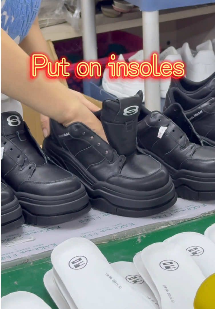 Put on insoles #shoes #factory #fyp #leathershoes #wholesale #sneakerfactory #sneakers #chinesefactory #tn #factorywork #trendingshoes #shoemaking #workshop 