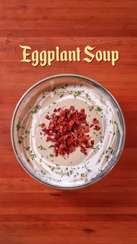 Roasted Eggplant Soup 🍆 | Soups So Good It Can Cure Any Sickness Ep. 9  INGREDIENTS  Roasted Eggplant Soup: - 6-8 eggplants - 1 cup cashews, toasted - 1 white onion, chopped - 10-12 cloves of garlic, chopped - 1 tbsp of fish sauce (or to taste) - 1/2 cup cooking cream - 10 strips of bacon, chopped  - Chicken stock as needed - Pepper - Parsley to top INSTRUCTIONS:  - Roast the eggplants over an open flame until charred. Peel off the skin, place the flesh in a bowl, and cover with plastic wrap. Set aside to steam. - In a separate pan, toast the cashews until fragrant and lightly browned. - Render the sliced bacon in a hot pan over medium heat until crispy and golden. Remove and set aside. - Once steamed, remove the eggplants from the bowl and mince them. - In the same pan with the rendered bacon fat, sauté the onions and garlic. - Add in your eggplant mince, along with the toasted cashews and chicken stock. Season with fish sauce and pepper. - Transfer the mixture to a blender and process until smooth. - Return the mixture to the pan, stir in cream, and mix until well combined. - Garnish with the bacon strips and parsley. Serve and enjoy! #asmr #Soups # ASMRCooking 