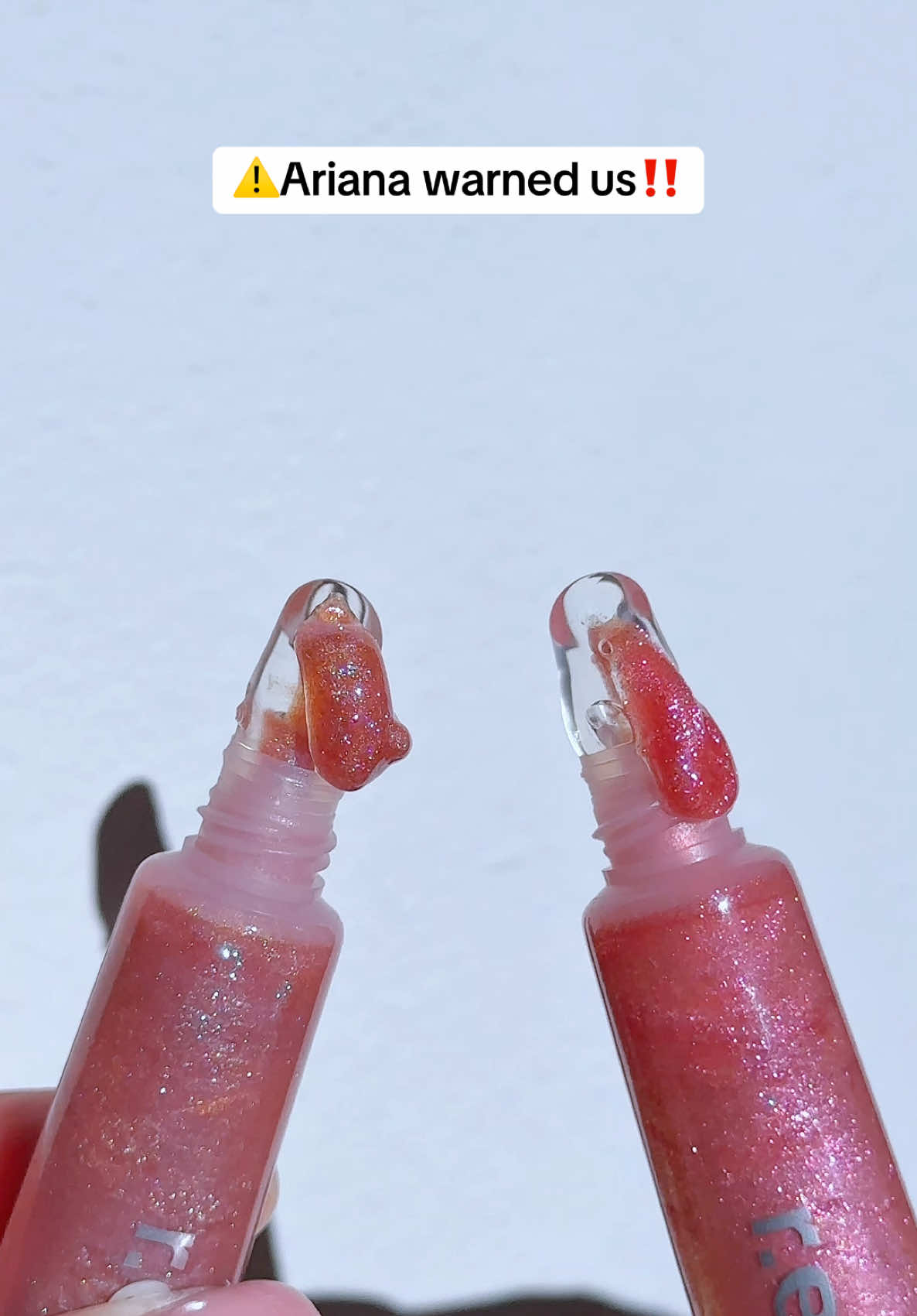 So spicy n shimmery 🌶️🥵✨✨✨ @r.e.m. beauty  r.e.m. beauty plumping lip gloss in fembot & 7 rings • triple-plump actives for instantly fuller lips and nourishing hydration • non-sticky • high shine #rembeauty #arianagrande #plumpinglipgloss #shimmerylipgloss #TikTokShopNewArrivals 