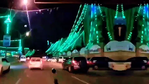 Photographing the green lights that decorate the streets for the celebration (CTA)