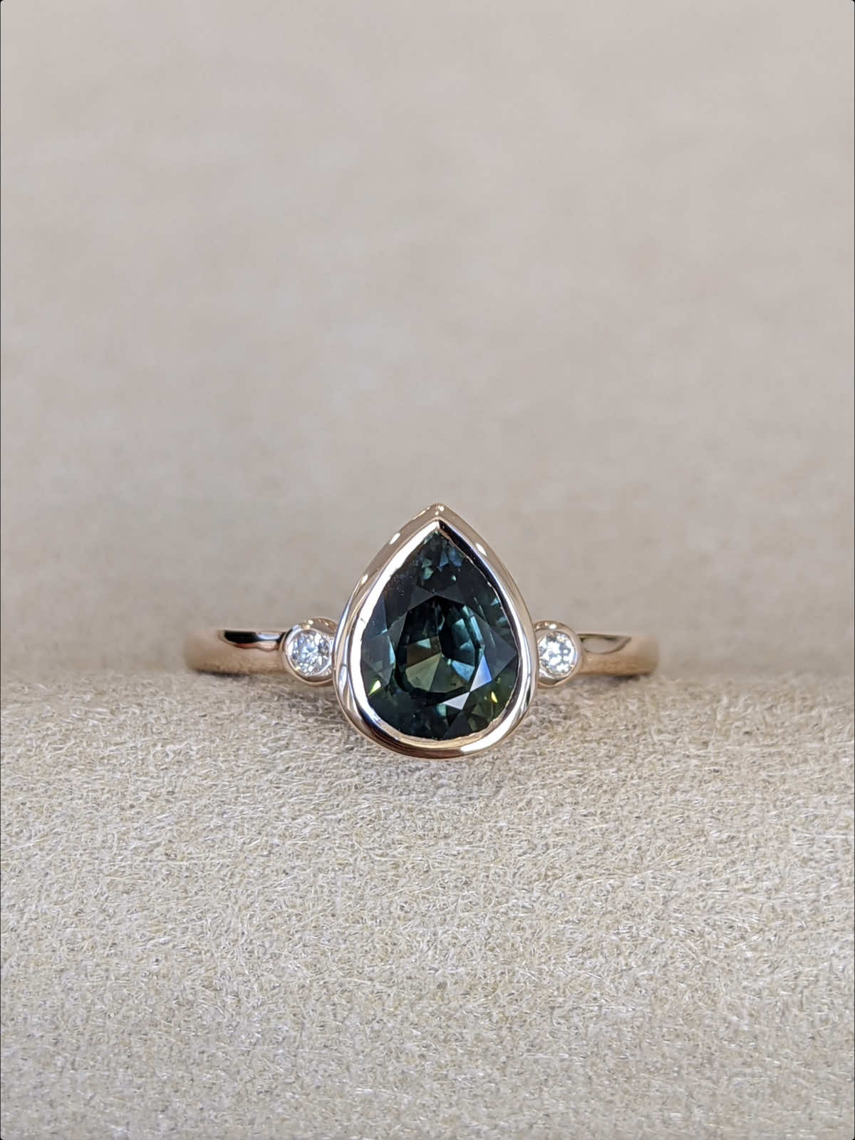 A sleek bezel-set three-stone design, showcasing a center gem flanked by two sparkling accent diamonds. Perfectly balanced for elegance and everyday wear — DM us. #BlueSapphire #greensapphire #NaturalSapphire #TimelessBeauty #SapphireGlow #SapphireLovers #LuxuryJewelry #ElegantStyle #FineJewelry #uniquerings #sapphire #SapphireRing 
