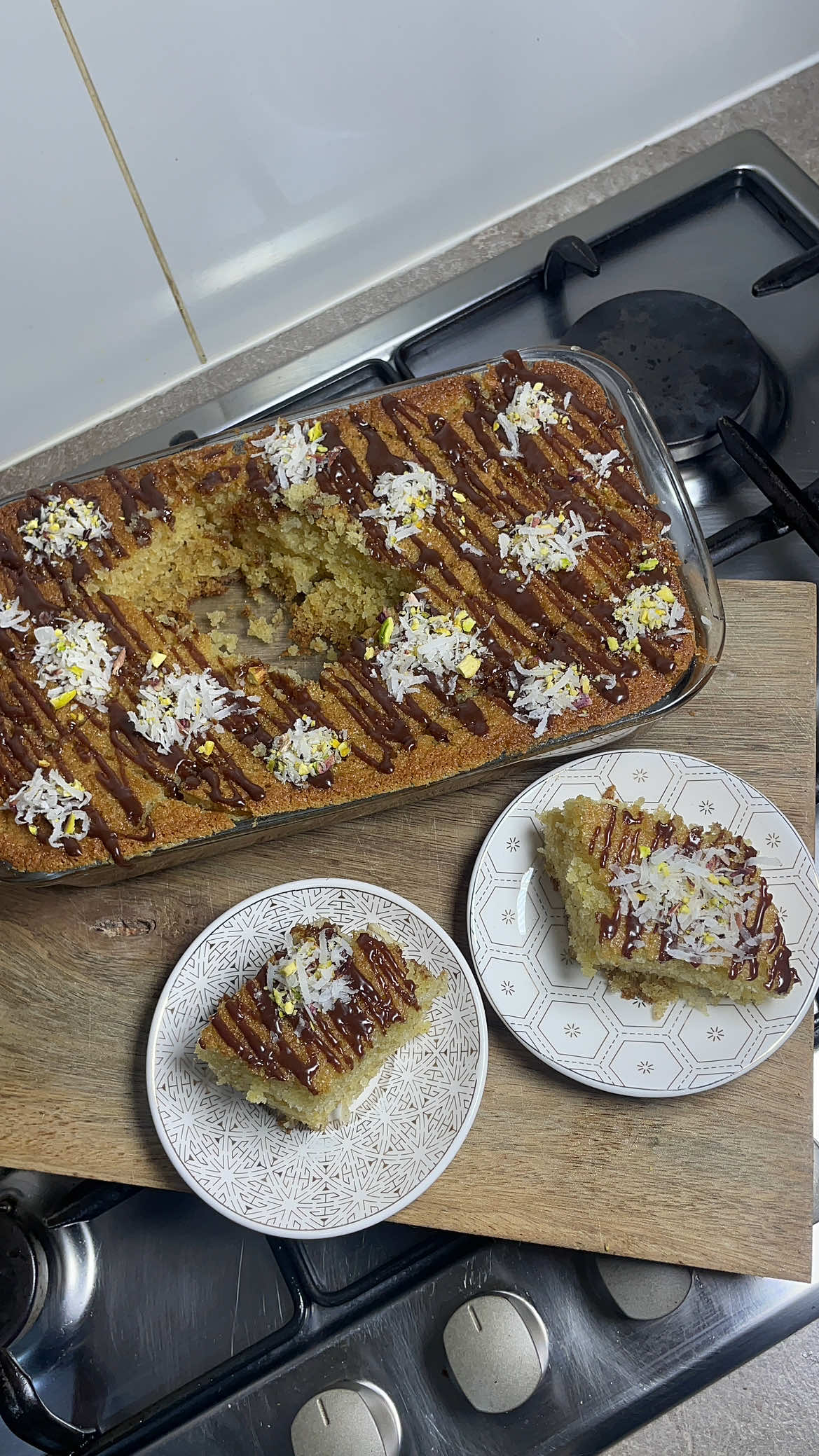 Basbousa ingredients  Semolina Sugar Desiccated coconut  Eggs Oil/butter Milk Chocolate  Pistachio  Sugar syrup  Salt