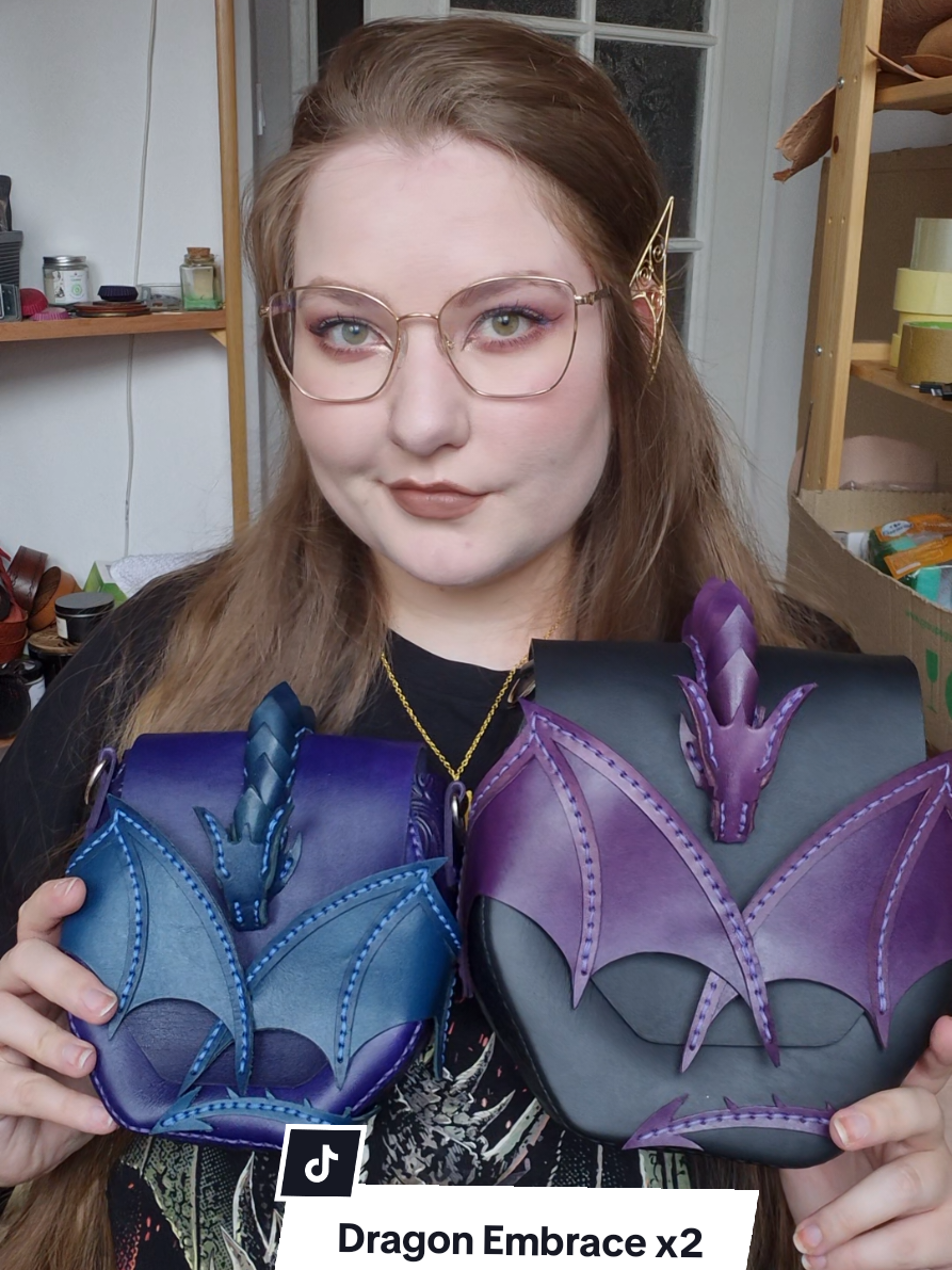 Our newest addition – the classic Dragon Embrace dragon bag, but in an XL version! In one of my previous videos, you'll see me packing the smaller version to see what can fit in it. My husband's @BeardedDragonWorkshop  latest video shows me packing the large version – specifically, how many bananas can fit in it. 😎  You can find both in our Etsy shop and our Polish online store ❤️ #fantasyaesthetic #fantasycore #handmadecraft #fantasy #dragons 