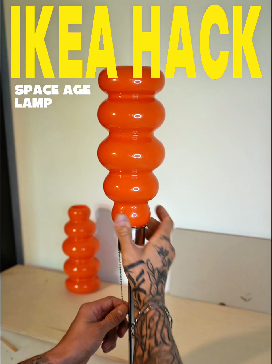 Handmade IKEA hack turned into a retro-futuristic lamp. The bold orange glass shade and sleek chrome base give it that unmistakable 70s space-age vibe—playful, sculptural, and totally unique. [Make sure to use a low voltage led bulb] +  for extra precautions  [drill a small hole  in the vase for heat dissapation] always  research and monitor your handmadecreations :)    #SpaceAgeDesign #70sVibes #IKEAHack #RetroLamp #VintageInspired 