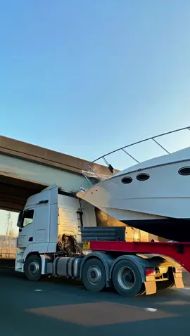The man was filming his yacht being transported when the truck carrying it failed to clear a bridge — the yacht’s bow struck the structure, the hull broke apart, and it fell off the trailer onto the road. #crash #ai #news #fail #wow         