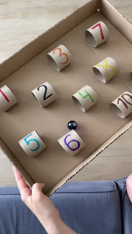Fun DIY number maze challenge you’ve got to try at home 🤩 Make a simple and fun maze with cardboard and numbered tunnels from toilet paper rolls. Kids guide a ball through the tunnels in order, building coordination, balance, and focus as they play. For beginners, start with a soft pom-pom for easier control. Ready for a challenge? Level up with a marble!🔥 #kidsactivities #cardboardcrafts #mathgames #usamom #homeschoolideas  