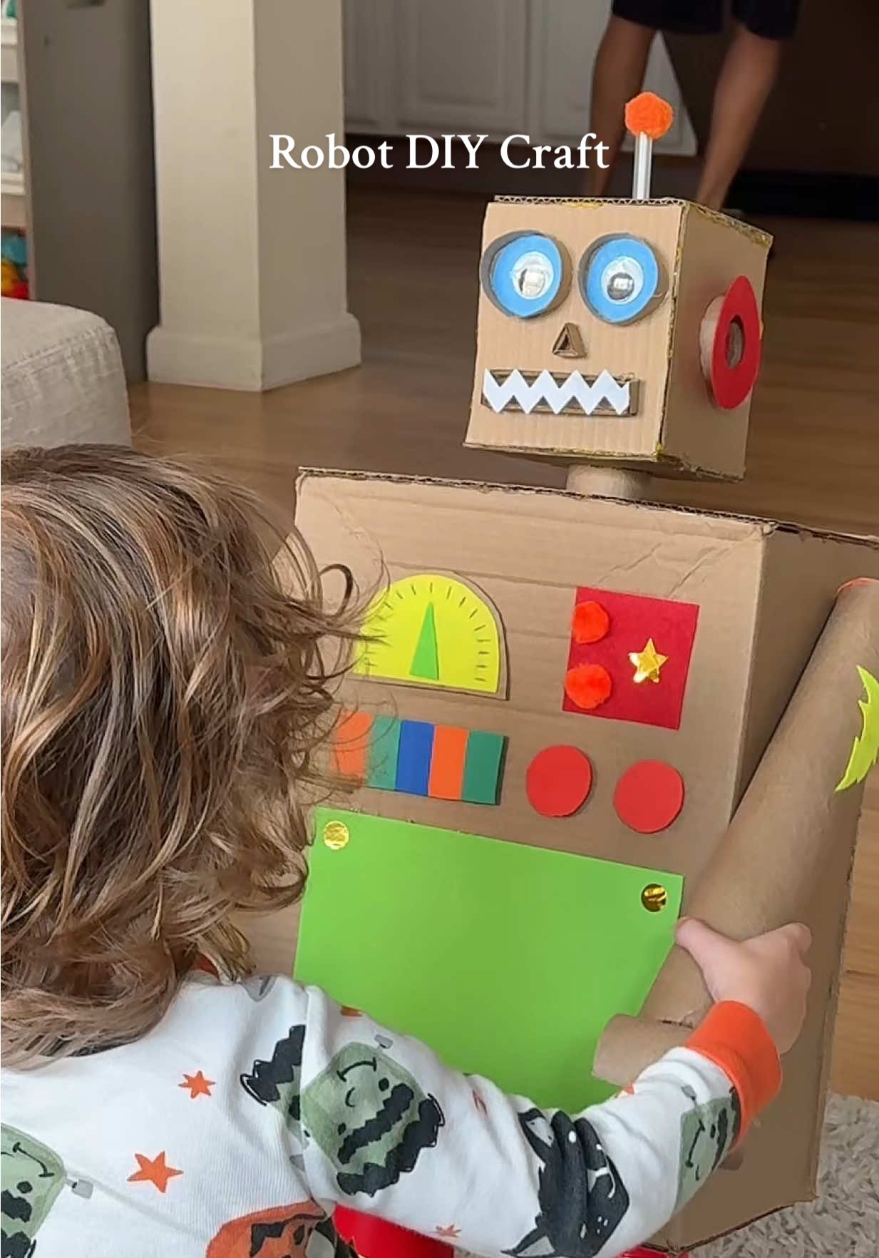 Mom & toddler cardboard robot DIY craft idea 🤖✨ He asked to make a robot so I built one entirely from recycled cardboard, hot glue, craft scraps, and a little creativity! Love how it turned out!  #toddlermom #toddlercrafts #diycraft #craftideas #fyp 