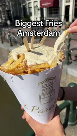 Hungry for Amsterdam’s biggest portion of fries?🍟🤤 Find this massive cone of Dutch fries at @‘t Pareltje in the city centre 🇳🇱 We also added truffle mayo and Parmesan as toppings, and they even do two layers🙏🏼 This XXL size is 19.5, and is recommended for four people ✨ t’Pareltje📍 #creatorsearchinsights #flavouritesofficial #amsterdamfoodguide #amsterdamfood #tpareltje 