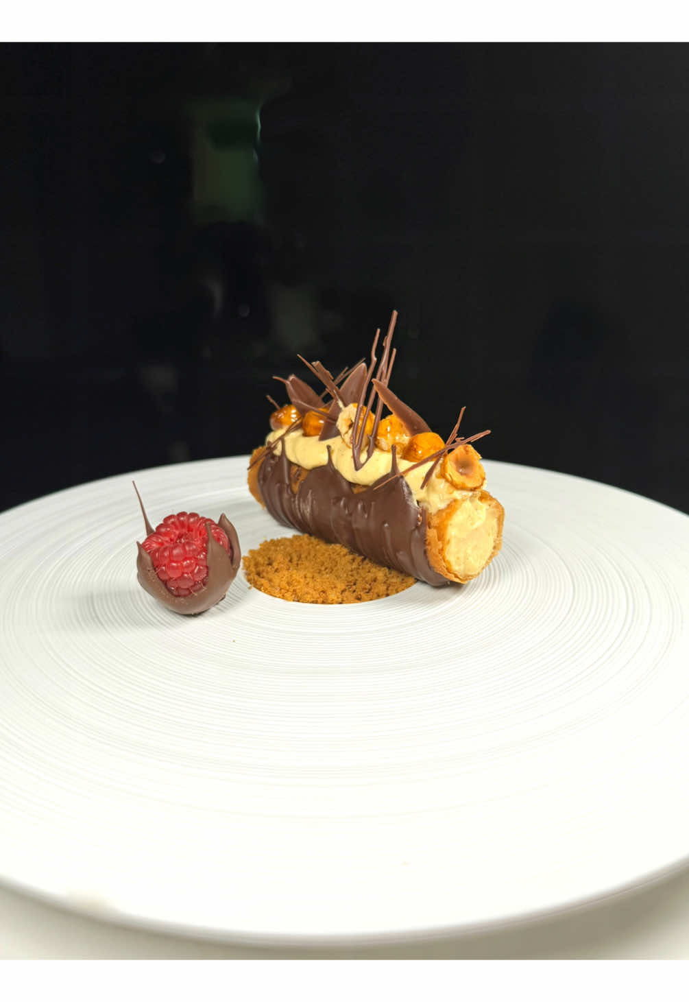 Hazelnut Praline Mousseline (Crème Mousseline au Praliné) filled Gavotte Dessert with Chocolate, hazelnuts and raspberries.  What makes this special is the crispy wafer thin garnish for extra flavor and texture, a wow factor to this dessert is the Crepe Dentelle.  I love my desserts like I love my people, beautifully on the outside and inside too, so of course you will find a silky hazelnut praline filling inside wafer thin layers of crepe Dentelle  or gavotte ♥️  #hazelnuts #praline #desserts #crepe #asmr 