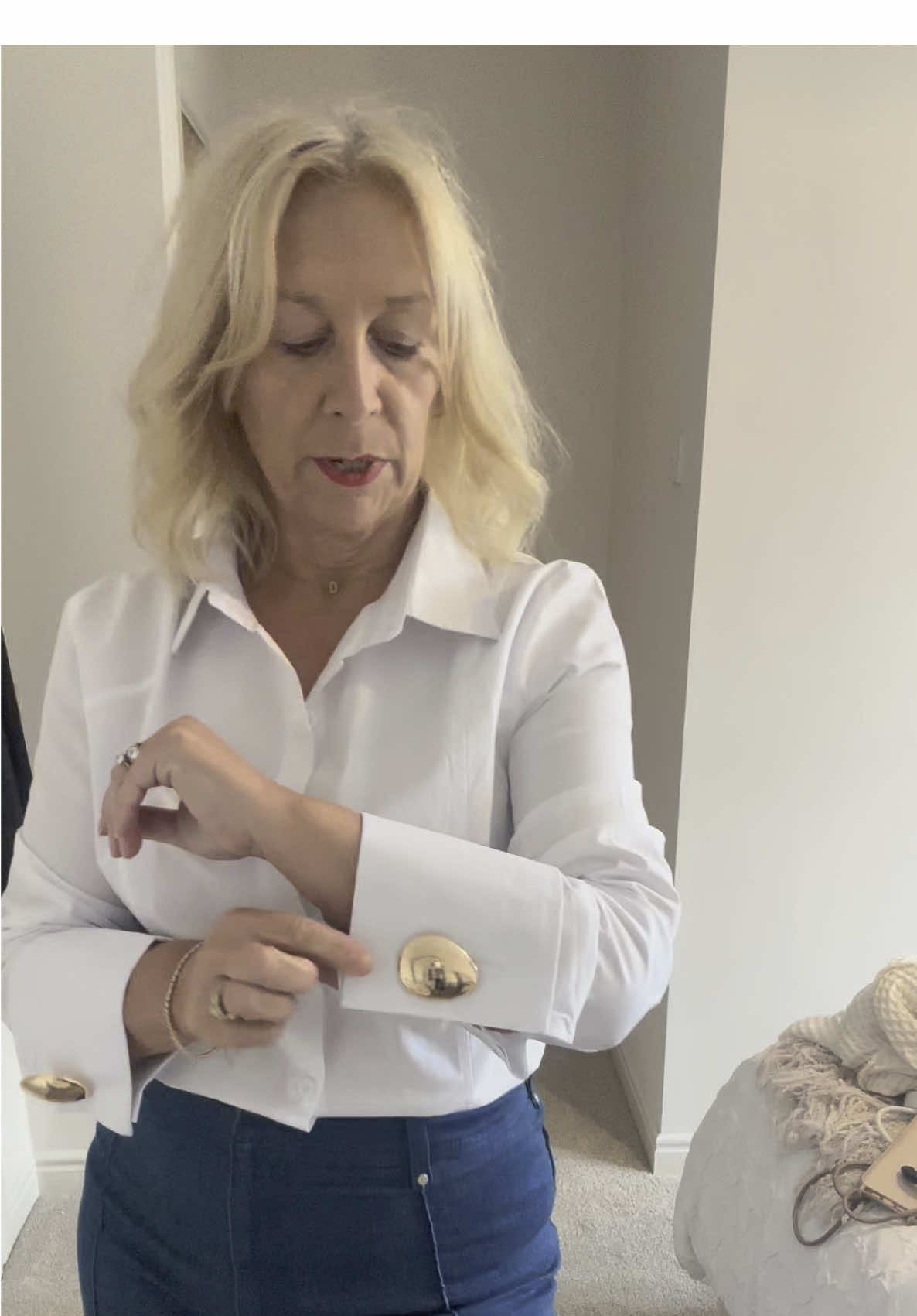 How fabulous is this white shirt from Uoozee, the classic design is elevated with extra wide cuffs and statement buttons, simply classy and elegant.  #over50style #outfitsinspo #classicstyle #OOTD #ladiesfashion 