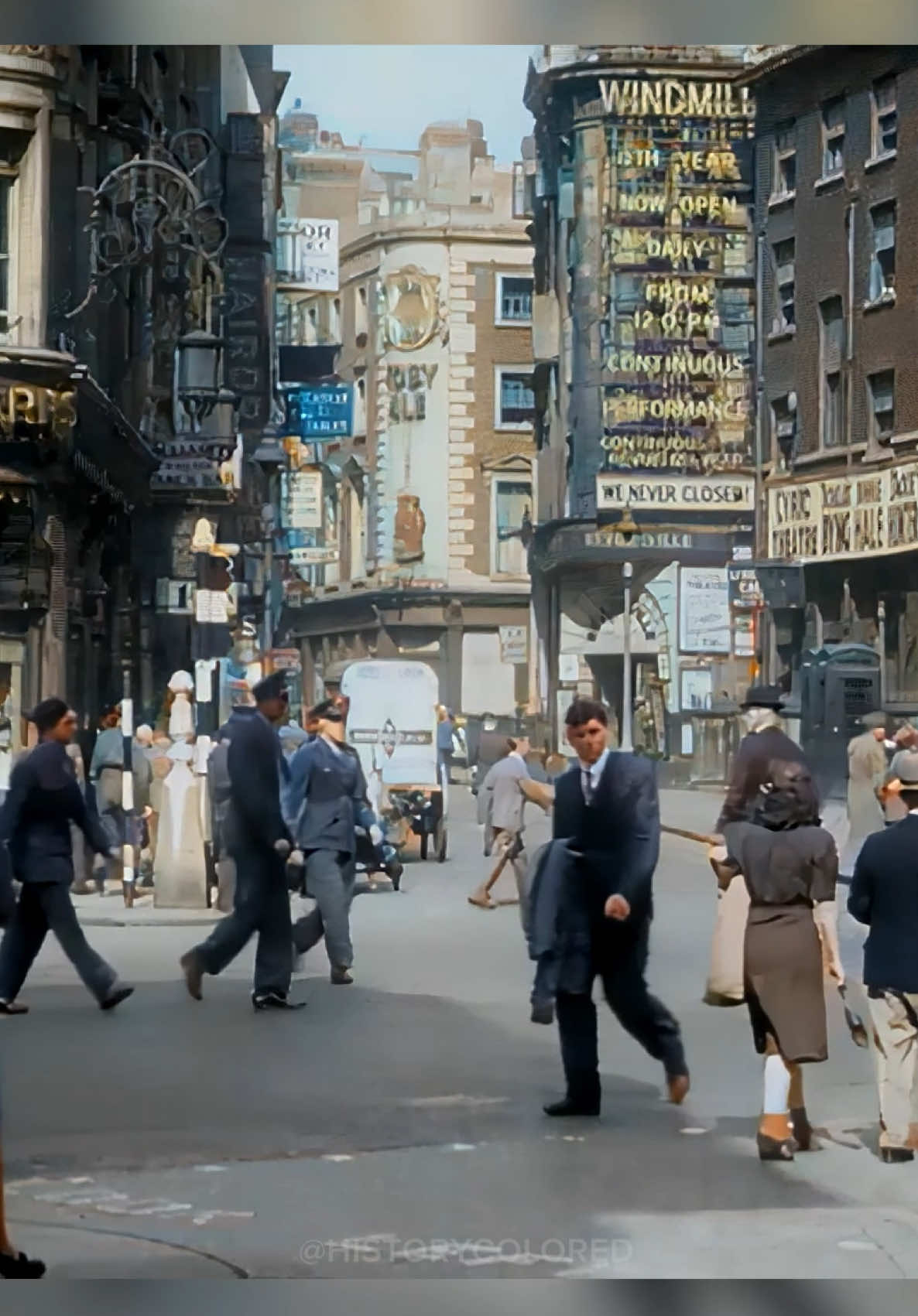 Restored footage from the 1940s showing a view down Great Windmill Street from Shaftesbury Avenue in London, England. - Footage frame rate increased, upscaled and “colorized” by HistoryColored using AI technology. - Footage originally from: PET 980 R 1 B London, Internet Archive, CC BY 2 . 0 - #History #london #england #historicalfootage
