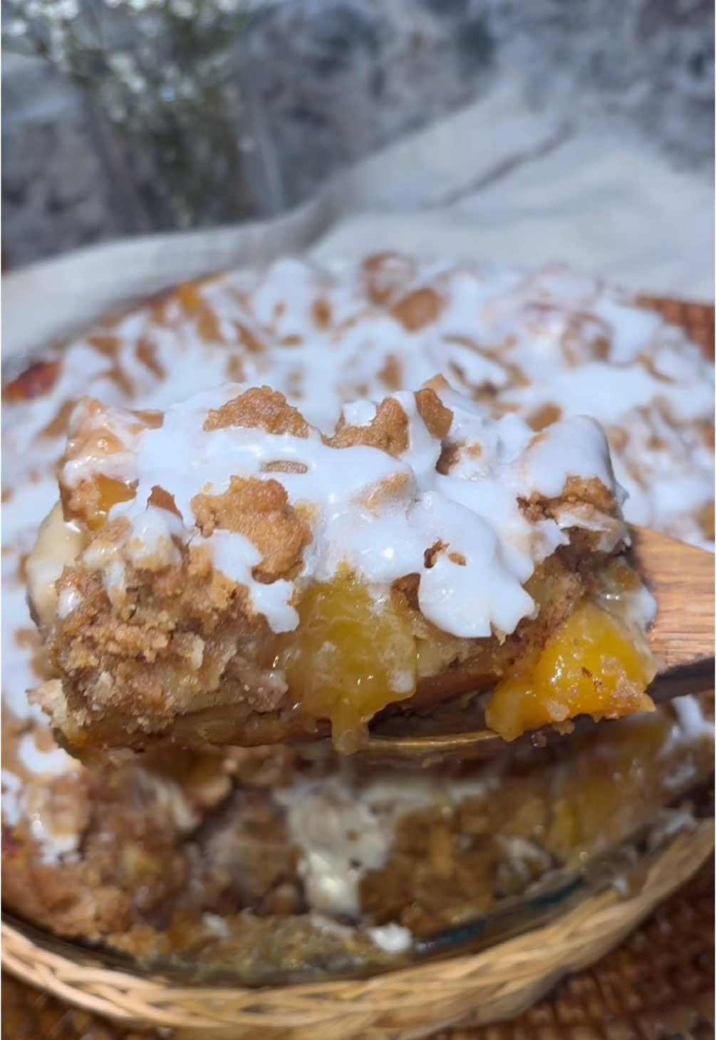 🍑Peach Cobbler Cinnamon Roll Casserole RECIPE 👇  You guys have been asking me for a peach version so here it is!! Same as the blueberry and strawberry version, get ya cinnamon rolls cut up, throw in a pie dish, add the peaches and bake to sweet perfection 🍑 What you need ⬇️  1 can (8ct) cinnamon rolls, you can use homemade  1/4 cup heavy cream 1 can pie filling (I just pull the peaches out and leave excess filling in the can)  4 tablespoons melted butter 1/2 cup flour 1/2 cup brown sugar  How to make ⬇️  🍑Cut cinnamon rolls into small pieces  🍑Pour heavy cream into pie dish and add cinnamon rolls on top  🍑Add peaches  🍑In a separate bowl mix melted butter, flour, brown sugar together until it’s dry and crumbly. Add to top of peaches.  🍑Bake at 350 degrees for 25-30 minutes. Keep an eye on it at the last 5 minutes so the top doesn’t burn.  🍑Add icing from cinnamon rolls can or make homemade with powdered sugar, vanilla and milk.  Enjoy!! 