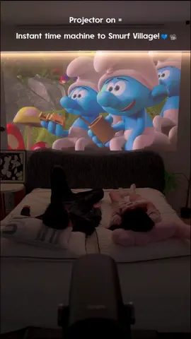 When adulting hits but your inner child refuses to grow up 💙📽️ Projector on = Instant time machine to Smurf Village! 4K memories with my old blue friends 🫂✨ Turns out growing up just means upgrading our magic 🪄 #NostalgiaModeActivated #SmurfsForever #NostalgiaAttack #ChildhoodUnlocked #ProjectorMagic #90sKids #AdultingWithCartoons #ThrowbackVibes #BlueSpirits #CozyNights #RetroRewind #TikTokMemories#projector #projectorscreen #dangbei 