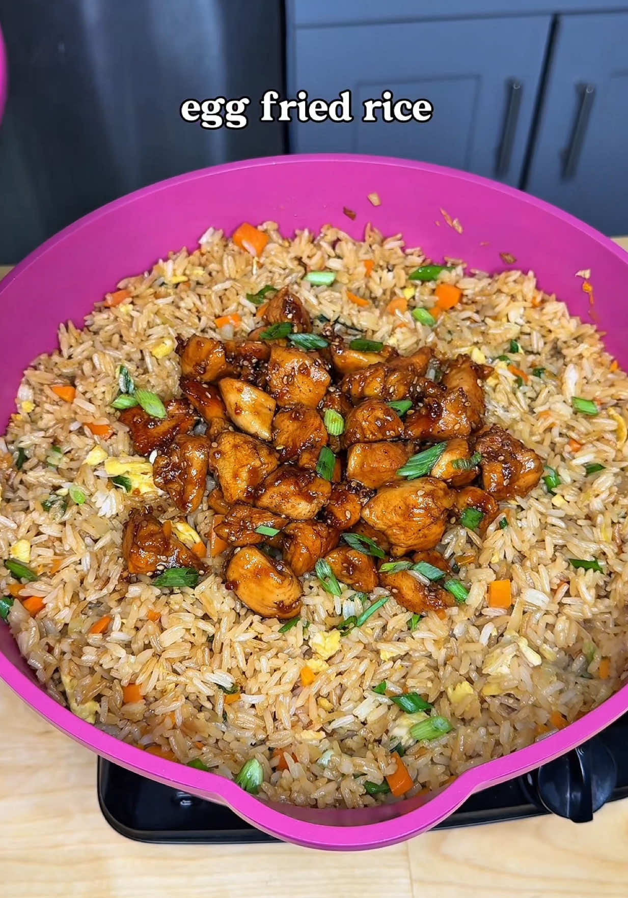 This egg fried rice is so easy and delicious—I know you’ll want to make it all the time! Egg Fried Rice Recipe: 	•	Cooked cold rice 	•	Garlic cloves, smashed 	•	Carrot, diced 	•	White onion, diced 	•	Green onions, chopped (save some for garnish) 	•	Eggs, beaten 	•	Soy sauce 	•	Sesame oil 	•	Oil (for cooking) Instructions: 	1.	Heat oil in a pan or wok over medium heat. Add carrots, white onion, green onions, and garlic. Sauté for a few minutes. 	2.	Push the veggies to the side and pour in the beaten eggs. Let them cook, then mix everything together. 	3.	Add the cold rice, mix well, then pour in the soy sauce and sesame oil. Stir until everything is combined. 	4.	Top with more green onions! I paired mine with chicken teriyaki for the perfect meal! Let me know if you’re making this. 🍚✨ [ how to make fried rice, easy rice recipe, egg fried rice, chicken teriyaki, easy dinner ideas ] #fridrice #EasyRecipe #eggfriedrice #asianrecipes #DinnerIdeas 