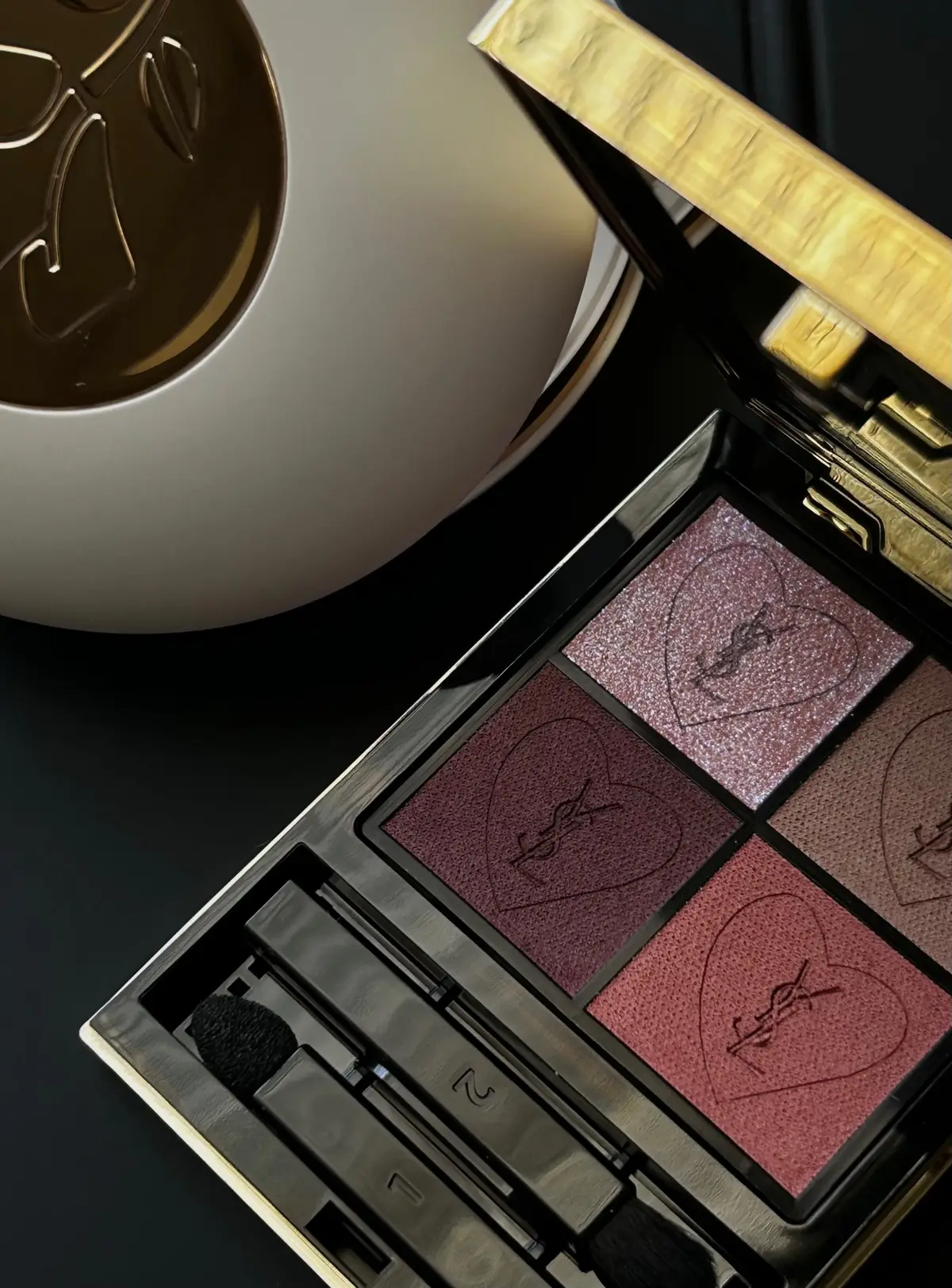 Some things old + new that I’m loving🪞🖤 Slide 1: @YSL Beauty Couture mini clutch eyeshadow palette 2: @MERIT Beauty Great Skin Double Cleanse (SO good). 3: @pradabeauty lip balm in Astral Pink & @Kevyn Aucoin eyelash curler 4: Swatches of the @Lancôme Hypnôse eyeshadow palette 5: YSL lippies = a must *This post features some gifted / PR products. #photodump #beautycreator #makeup #luxebeauty #gifted