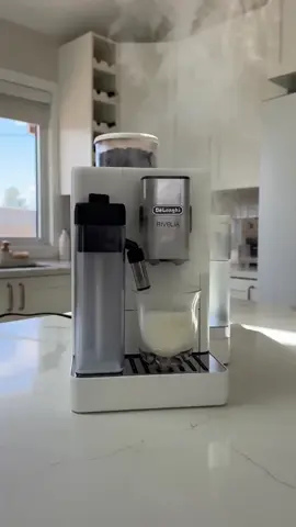 She’s here and she’s fabulouss! 🤍 Our new De’Longhi Rivelia in Arctic White just arrived and we are obsessed. We’ve been on the hunt for an aesthetic, fully automatic espresso machine… and turns out there are barely any in white! So when we saw this one drop, we knew she had to join the family.🫶🏻 And she’s a total game changer: two bean hoppers (hello decaf and espresso), a built-in grinder, velvety milk foam, 18+ drink options (who knew you could have so many coffees at the press of a button), and a sleek touchscreen… it’s basically a full café in our kitchen. What should we name her? ☕️✨