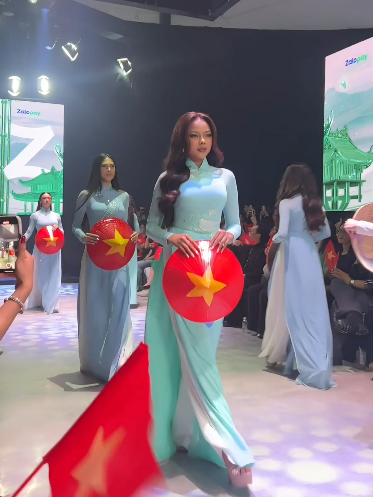 A stunning blend of fashion, technology, and culture lit up the runway!  @sreypiiphorn_, Miss Cosmo Cambodia 2025, graced the @zalopay.vn X @misscosmovn.unimedia Tech-shion Show: See Now Scan Now, walking alongside fellow @misscosmo.unimedia 2025 delegates from around the world. #MissCosmo #MissCosmoCambodia #MissCosmoCambodia2025 #ImpactfulBeauty #BeautyWithPurpose #InfluenceAgency