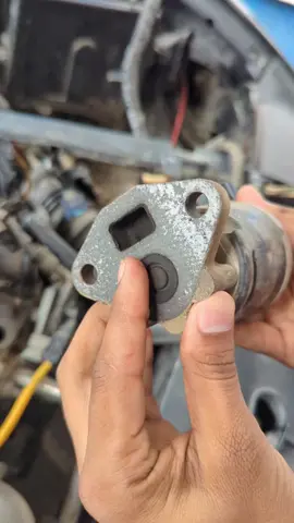 EGR (Exhaust Gas Recirculation) valve is a component in a vehicle's engine that recirculates a portion of exhaust gas back into the engine's intake manifold. @Sameer_AutoElectrician  @Alsharif Auto Branch 2  @ASA Car Information  @ASA Auto Tricks  #egr  #combustion  #manifold  #intake  #valve  Its main purpose is to lower combustion temperatures and reduce harmful nitrogen oxide (NOx) emissions, which are formed at high engine temperatures. A faulty EGR valve can lead to engine performance issues like reduced power, rough idling, and a lit check engine light.  _____ How it Works 1. Reduced Combustion Temperature: By introducing inert exhaust gases into the intake, the EGR valve dilutes the air/fuel mixture and lowers the oxygen level and combustion temperature.  2. NOx Emission Control: Lower temperatures in the combustion chamber significantly decrease the formation of nitrogen oxides, a major pollutant.  3. Controlled Recirculation: The EGR valve opens and closes to control the amount of exhaust gas that is recirculated based on driving conditions and engine load.  _______ Symptoms of a Faulty EGR Valve Check Engine Light:  A malfunctioning valve will often trigger the check engine light.  Poor Engine Performance: This can include a noticeable decrease in engine power and acceleration.  Rough Idle: The engine may run poorly or vibrate excessively when idling.  Increased Fuel Consumption:  In petrol engines, a stuck EGR valve can increase the chance of spontaneous combustion or engine knock, leading to higher fuel use.  Failed Emissions Test: A faulty EGR valve can cause the vehicle to fail an emissions test. 