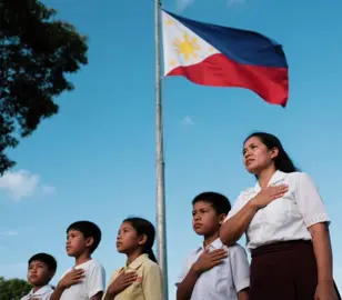 Pagpupugay sa Bandila – The Flag Salute Tradition The Filipino flag is not just a piece of cloth; it is a symbol of identity, unity, and history. The tradition of “Pagpupugay sa Bandila” (Salute to the Flag) began in the early 20th century, when schools, government offices, and even small communities started their day with a flag-raising ceremony. This practice was more than a routine—it was a reminder to every Filipino of the sacrifices made by heroes who fought for independence. During these ceremonies, people would gather, stand straight, and sing the national anthem, “Lupang Hinirang.” The flag would be raised slowly, with everyone’s eyes fixed on it, and silence or solemnity was expected throughout. In the past, barangays and small towns also held flag ceremonies during fiestas or important gatherings. Children learned from a young age to place their right hand over their chest while singing, while soldiers and policemen gave a proper salute. It was considered not only an act of respect to the nation, but also an expression of pride in being Filipino. Over time, however, this tradition has become less observed in daily life outside of schools and government institutions. Many younger generations may no longer feel the same deep connection to the ceremony, especially in a fast-moving, modernized society. Yet, its importance remains. It reminds Filipinos that beyond personal struggles, they are part of a greater community tied together by shared history, values, and aspirations. The act of saluting the flag is a simple gesture, but it carries profound meaning: unity, respect, and remembrance. Preserving this tradition is not just about repeating a ritual—it is about keeping alive the story of the Filipino spirit, one that has endured hardships but continues to rise with hope and dignity. #FilipinoTradition #PagpupugaySaBandila #PhilippineFlag #philippineshistory #philippines 