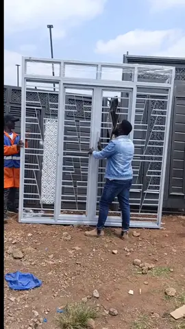 Full glass sliding steel door with burglar proof grills to enhance security🔥🔥🔥. We are a trusted steel fabrication company specializing in the design, manufacturing, and installation of high-quality steel doors, windows, gates, staircases, and balcony grills. With a commitment to strength, precision, and modern design, we deliver products that guarantee security, durability, and aesthetic appeal for our clients.We are located at TATU city along Ruiru-Kiambu road.#foryou #kenyantiktok🇰🇪 #foryoupage #doors #welding 