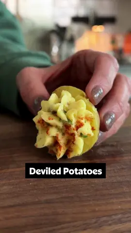 No eggs? No problem! 🫡 Meet the deliciously deceiving Deviled Potatoes! 🥔 They make the perfect gameday appetizer and are budget-friendly, too. Be sure to click the link in the @allrecipes bio or continue reading for the full recipe! 🔗 Ingredients: 1 1/2 pounds baby gold potatoes 1 tablespoon kosher salt, plus more to taste 1/2 cup mayonnaise 2 teaspoons yellow mustard 1/4 cup sweet pickle relish 1/4 cup finely chopped green onions 1/2 teaspoon freshly ground black pepper 1/2 teaspoon paprika chopped chives for garnish Directions Cover potatoes by 2 inches with water in a large saucepan. Add salt and bring potatoes to a boil over high heat. Cook until potatoes are fork tender, about 12 minutes, and drain. When potatoes are just cool enough to handle, cut each one in half lengthwise, to most resemble the shape of an egg. Use a small measuring spoon or melon baller to scoop out the center of each potato, leaving about a 1/8-inch border. Add potato flesh to a bowl.  Mash potato flesh with a fork and stir in mayonnaise, mustard, relish, green onions, and  pepper. Season with salt to taste. Spoon or pipe mixture into each potato “shell” and sprinkle with paprika. Sprinkle with chives if desired and serve immediately or refrigerate until ready to serve. 👨‍🍳: Nicole  #potatoes #deviledeggs #potatosalad #easyappetizers #easymeals 