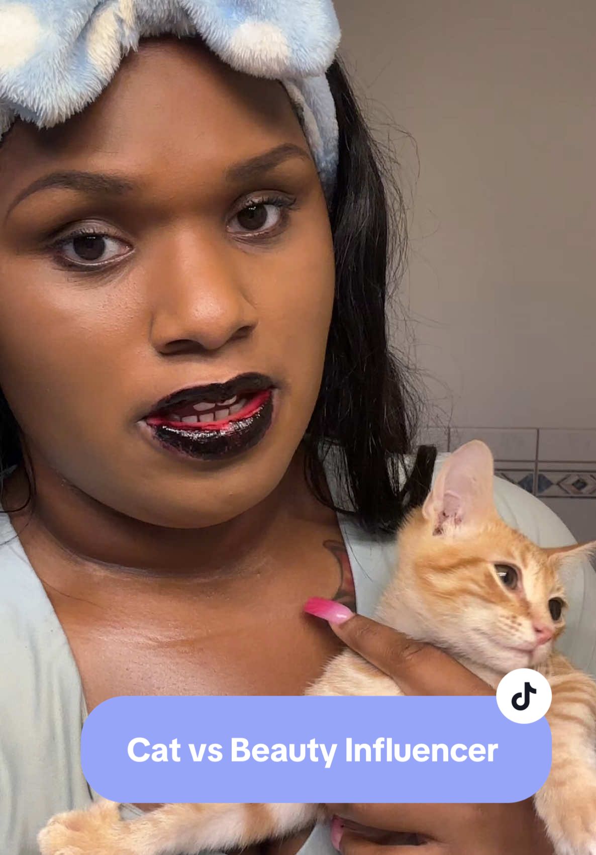 When you’re trying to become a beauty influencer but your cat won’t let you be great 🐱💄 I’m wearing the @milktouch US Black Peel Off Lip Tattoo in Black Cherry (bold, smudge-proof, transfer-resistant) and topping it with the @laneige_us Glaze Craze Tinted Polypeptide Lip Serum for that juicy shine + peptide care ✨ Even with a furry assistant in the way, these lips are staying cute 💋 #spotlightfinds #tiktokshopcreatorpicks #catmom #catsoftiktok #BeautyTok