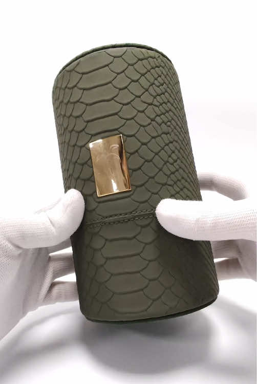Custom luxury textured PU leather cylindrical perfume box, with hot foil stamping, aluminum LOGO plaque, ​post and hole closure​​, and hand-stitched, high-end exquisiteness.#perfumebox #tubebox #puleather #perfumepackaging #packagingfactory 