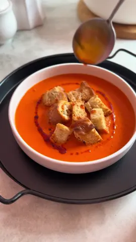 SPICY ROASTED PEPPER SOUP 🌶️ 🍅 This is a “whatever you have” recipe. Once every two weeks I need to clean out my fridge, I find out what’s in there that I had forgotten and then make a meal. I saw a similar recipe on @Unas_Minikitchen that was the inspiration for my roasted soup.  Step 1 Preheat oven to 200 C and prepare a baking tray.  Step 2 To the baking tray, add 5 chopped Red Bell Peppers, 4 quartered Tomatoes, 3 halved Shallots, 1 quartered Red Onion and 4 small Cayenne Chillies. Then spread 3 tablespoons of Olive Oil and some vegetable seasoning, I used Roast Cape Herb and Spice Veggie Seasoning. Toss vegetables to coat in the seasoning. Step 3 Roast vegetables in the oven to 20 minutes then flip and roast for a final 15 minutes. Step 4 Transfer roasted veggies to a blender and blend until smoothed to your preferred consistency. Step 5 Transfer the blended veggies to a pot and heat through. I added a cup of chicken stock at this point. I used a stockpot from Knorr and a cup of water. Step 6 Serve! I served mine with chilli oil and homemade Focaccia croutons that I made with homemade bread.  #roastedtomatoes #roastedpeppers #veggiesoup 